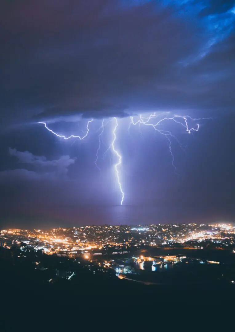 A lightning strike is seen over the city.